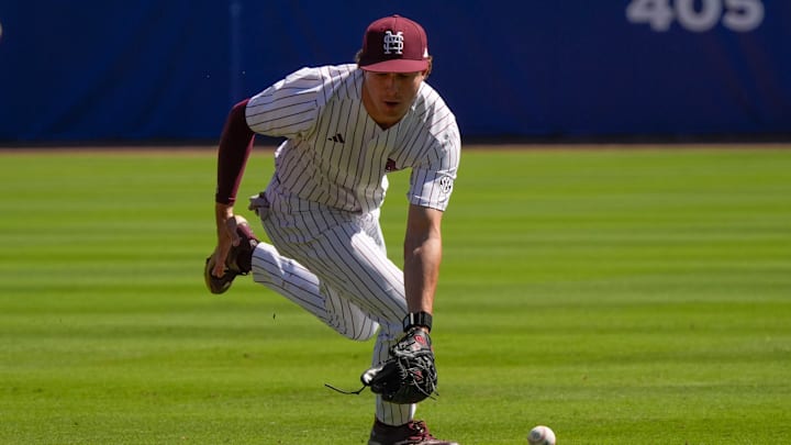 May 21, 2025; Hoover, AL, USA; A ground ball slips under the glove of Mississippi State second baseman Gatlin Sanders (49) during the six-run second inning for Texas A&M in the first round of the SEC Baseball Tournament at the Hoover Met.