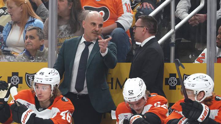 Apr 27, 2026; Pittsburgh, Pennsylvania, USA;  Philadelphia Flyers head coach Rick touches (left rear) gestures on the bench against the Pittsburgh Penguins during the first period in game five of the first round of the 2026 Stanley Cup Playoffs at PPG Paints Arena.