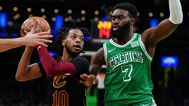 Dec 22, 2021; Boston, Massachusetts, USA; Cleveland Cavaliers guard Darius Garland (10) drives the ball against Boston Celtics guard Jaylen Brown (7) in the second quarter at TD Garden. Mandatory Credit: David Butler II-Imagn Images