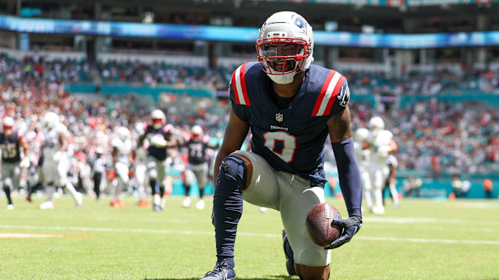 New England Patriots wide receiver Kayshon Boutte (9) races after scoring a touchdown against the Miami Dolphins in the first quarter  at Hard Rock Stadium. 
