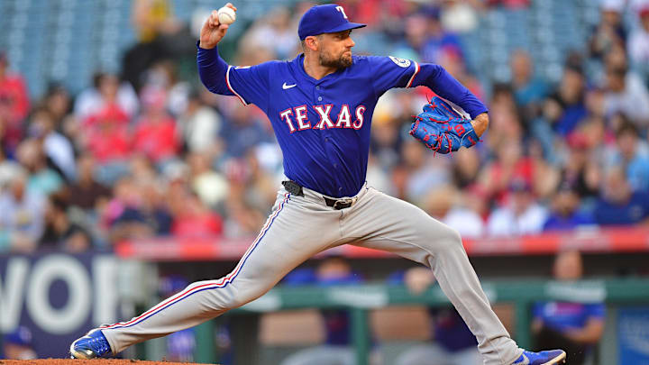 Jul 30, 2025; Anaheim, California, USA; Texas Rangers pitcher Nathan Eovaldi (17) throws against the Los Angeles Angels during the first inning at Angel Stadium. Jul 30, 2025; Anaheim, California, USA; Texas Rangers pitcher Nathan Eovaldi (17) throws against the Los Angeles Angels during the first inning at Angel Stadium.