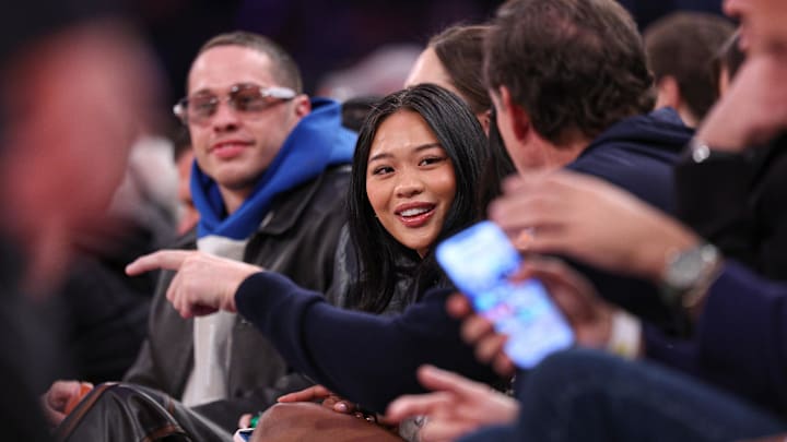 Apr 6, 2025; New York, New York, USA; American olympic gold medal gymnast Sunisa Lee sits courtside 
during the second half of the NBA game between the New York Knicks and the Phoenix Suns at Madison Square Garden. Mandatory Credit: Vincent Carchietta-Imagn Images