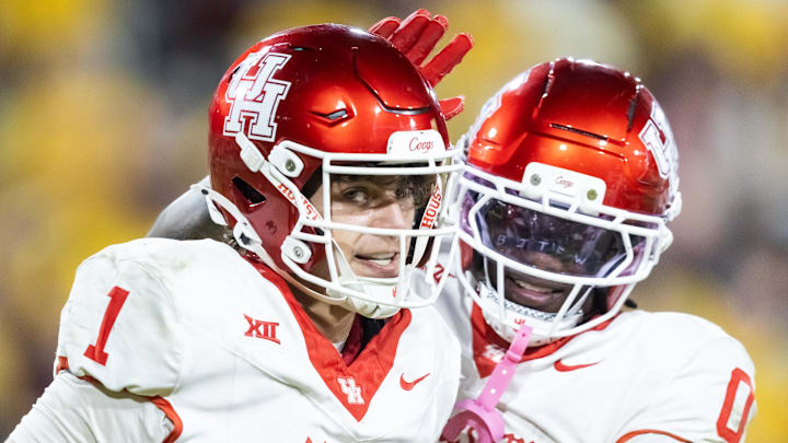 Oct 25, 2025; Tempe, Arizona, USA; Houston Cougars quarterback Conner Weigman (1) celebrates a touchdown with wide receiver Amare Thomas (0) against the Arizona State Sun Devils in the second half at Mountain America Stadium. Mandatory Credit: Mark J. Rebilas-Imagn Images