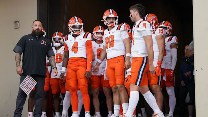Sep 20, 2025; Bloomington, Indiana, USA; Illinois Fighting Illini quarterback Luke Altmyer (9) leads his team onto the field prior to the game against the Indiana Hoosiers at Memorial Stadium. Mandatory Credit: Robert Goddin-Imagn Images