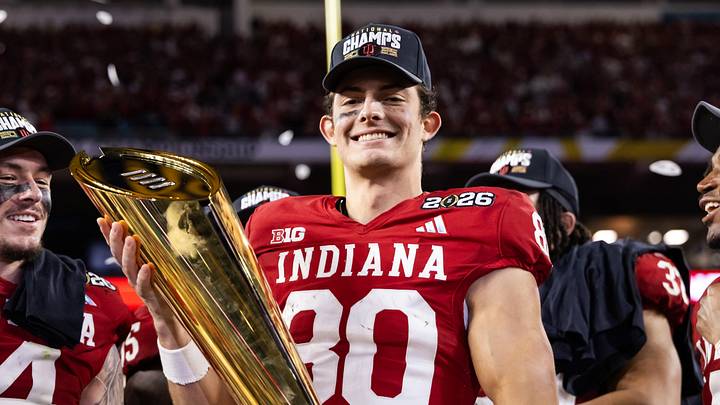 Jan 19, 2026; Miami Gardens, FL, USA; Indiana Hoosiers wide receiver Charlie Becker (80) celebrates with the trophy after defeating the Miami Hurricanes in the College Football Playoff National Championship game at Hard Rock Stadium. Mandatory Credit: Mark J. Rebilas-Imagn Images Jan 19, 2026; Miami Gardens, FL, USA; Indiana Hoosiers wide receiver Charlie Becker (80) celebrates with the trophy after defeating the Miami Hurricanes in the College Football Playoff National Championship game at Hard Rock Stadium. Mandatory Credit: Mark J. Rebilas-Imagn Images