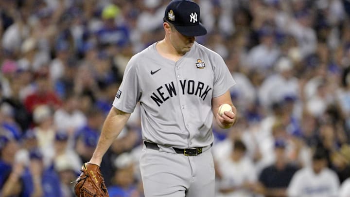 Oct 26, 2024; Los Angeles, California, USA; New York Yankees pitcher Carlos Rodon (55) reacts in the third inning against the Los Angeles Dodgers during game two of the 2024 MLB World Series at Dodger Stadium. Mandatory Credit: Jayne Kamin-Oncea-Imagn Images