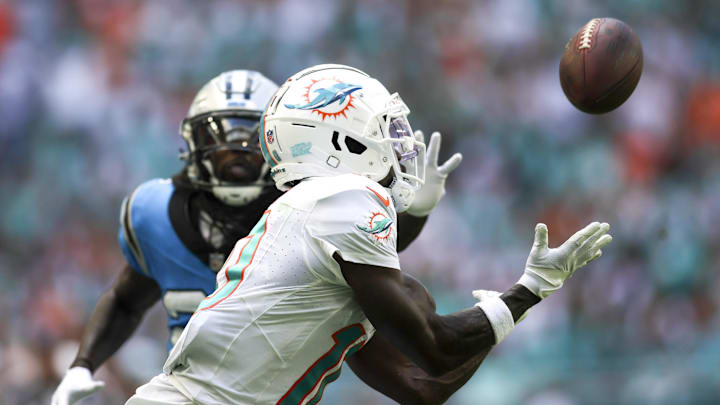 Oct 15, 2023; Miami Gardens, Florida, USA; Miami Dolphins wide receiver Tyreek Hill (10) catches the football for a touchdown against Carolina Panthers during the second quarter at Hard Rock Stadium. Mandatory Credit: Sam Navarro-Imagn Images