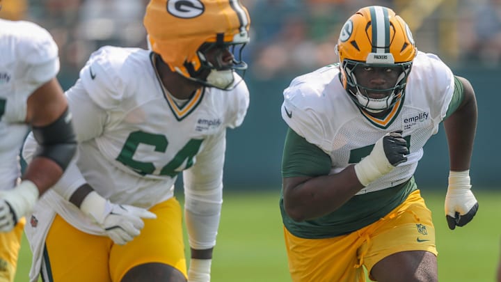 Green Bay Packers offensive tackle Anthony Belton (71) runs through a drill during practice on Thursday, July 31, 2025, at Ray Nitschke Field in Ashwaubenon, Wis.