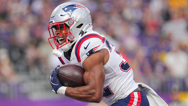 New England Patriots running back TreVeyon Henderson (32) celebrates his touchdown against the Minnesota Vikings in the first quarter at U.S. Bank Stadium.
