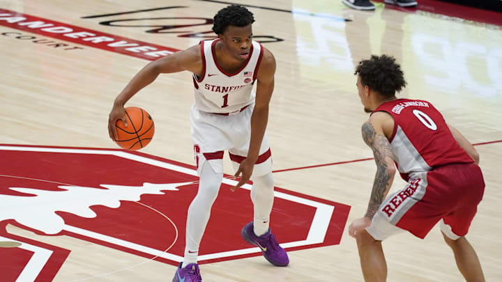 Dec 7, 2025; Stanford, California, USA;  Stanford Cardinal guard Ebuka Okorie (1) dribbles upcourt against UNLV Runnin' Rebels guard Dra Gibbs-Lawhorn (0) in the second half at Maples Pavilion. Mandatory Credit: David Gonzales-Imagn Images