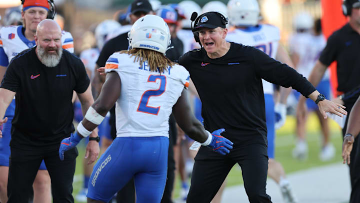 Boise State Broncos head coach Spencer Danielson reacts with running back Ashton Jeanty.