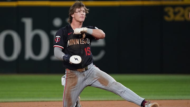 Sep 23, 2025; Arlington, Texas, USA; Minnesota Twins second baseman Luke Keaschall (15) keeps a foot on the base after stealing second during the second inning against the Texas Rangers at Globe Life Field.