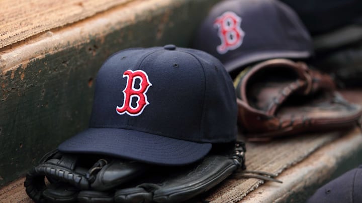 Aug 23, 2011; Arlington, TX, USA; Hats and gloves from the Boston Red Sox team near the edge of the dugout before the game against the Texas Rangers at Rangers Ballpark. Mandatory Credit: Kevin Jairaj-Imagn Images Aug 23, 2011; Arlington, TX, USA; Hats and gloves from the Boston Red Sox team near the edge of the dugout before the game against the Texas Rangers at Rangers Ballpark. Mandatory Credit: Kevin Jairaj-Imagn Images