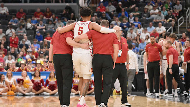 Mar 20, 2026; St. Louis, MO, USA; Iowa State Cyclones forward Joshua Jefferson (5) is helped off of the court after suffering an apparent injury to his left leg against Tennessee State Tigers during the first half of a first round game of the men's 2026 NCAA Tournament at Enterprise Center. Mandatory Credit: Jeff Curry-Imagn Images