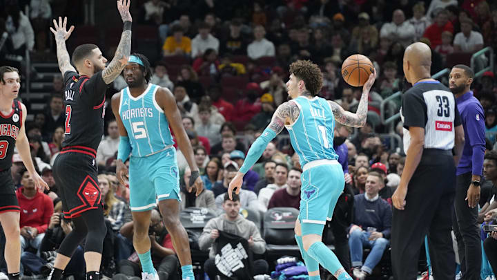 Jan 17, 2025; Chicago, Illinois, USA; Chicago Bulls guard Lonzo Ball (2) defends Charlotte Hornets guard LaMelo Ball (1) during the first quarter at United Center. Mandatory Credit: David Banks-Imagn Images