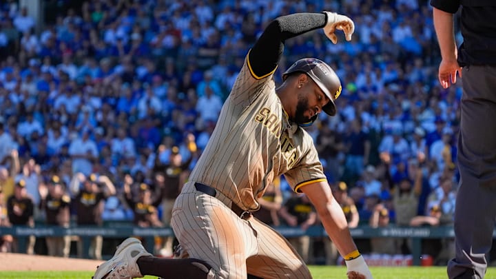 San Diego Padres shortstop Xander Bogaerts (2) slides safely into third base after a throwing error made by the Chicago Cubs in the second inning during game one of the Wildcard round for the 2025 MLB playoffs at Wrigley Field on Sept. 30.