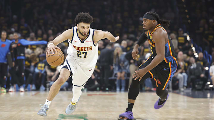 May 7, 2025; Oklahoma City, Oklahoma, USA; Denver Nuggets guard Jamal Murray (27) drives down the court beside Oklahoma City Thunder guard Luguentz Dort (5) in the first quarter during game two of the second round for the 2025 NBA Playoffs at Paycom Center. Mandatory Credit: Alonzo Adams-Imagn Images May 7, 2025; Oklahoma City, Oklahoma, USA; Denver Nuggets guard Jamal Murray (27) drives down the court beside Oklahoma City Thunder guard Luguentz Dort (5) in the first quarter during game two of the second round for the 2025 NBA Playoffs at Paycom Center. Mandatory Credit: Alonzo Adams-Imagn Images