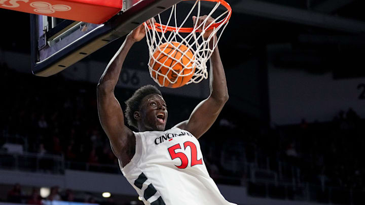 Cincinnati Bearcats center Moustapha Thiam (52) dunks in the first half of the NCAA men’s basketball game between the Cincinnati Bearcats and the NJIT Highlanders at Fifth Third Arena in Cincinnati on Monday, Nov. 24, 2025.