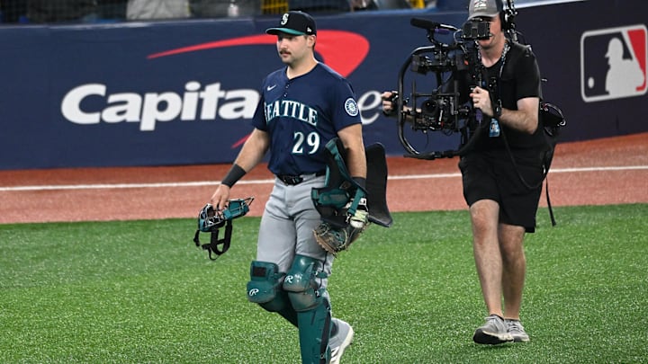 Oct 20, 2025; Toronto, Ontario, CAN; Seattle Mariners catcher Cal Raleigh (29) walks on field before game seven against the Toronto Blue Jays in the ALCS round for the 2025 MLB playoffs at Rogers Centre. Mandatory Credit: Dan Hamilton-Imagn Images