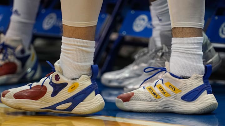 Feb 14, 2022; Lawrence, Kansas, USA; A general view of Kansas Jayhawks guard Christian Braun (2) shoes against the Oklahoma State Cowboys before the game at Allen Fieldhouse. Mandatory Credit: Denny Medley-Imagn Images Feb 14, 2022; Lawrence, Kansas, USA; A general view of Kansas Jayhawks guard Christian Braun (2) shoes against the Oklahoma State Cowboys before the game at Allen Fieldhouse. Mandatory Credit: Denny Medley-Imagn Images