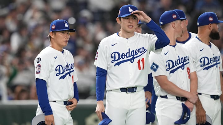 Mar 16, 2025; Bunkyo, Tokyo, Japan; Los Angeles Dodgers pitcher Yoshinobu Yamamoto (left) and pitcher Roki Sasaki (11) stand on the field before the game against the Hanshin Tigers at Tokyo Dome. Mandatory Credit: Darren Yamashita-Imagn Images Mar 16, 2025; Bunkyo, Tokyo, Japan; Los Angeles Dodgers pitcher Yoshinobu Yamamoto (left) and pitcher Roki Sasaki (11) stand on the field before the game against the Hanshin Tigers at Tokyo Dome. Mandatory Credit: Darren Yamashita-Imagn Images