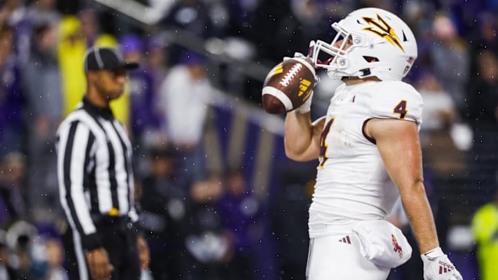 Oct 21, 2023; Seattle, Washington, USA; Arizona State Sun Devils running back Cameron Skattebo (4) celebrates after rushing for a touchdown against the Washington Huskies during the second quarter at Alaska Airlines Field at Husky Stadium. 