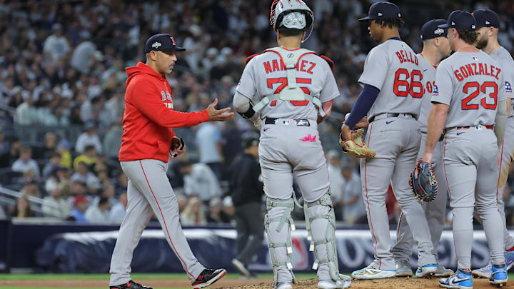 Oct 1, 2025; Bronx, New York, USA; Boston Red Sox manager Alex Cora (13) makes a pitching change during the third inning against the New York Yankees during game two of the Wildcard round for the 2025 MLB playoffs at Yankee Stadium. 