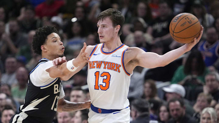 Mar 28, 2025; Milwaukee, Wisconsin, USA; New York Knicks guard Tyler Kolek (13) looks for an outlet against Milwaukee Bucks guard Ryan Rollins (13) in the first half at Fiserv Forum. Mandatory Credit: Michael McLoone-Imagn Images