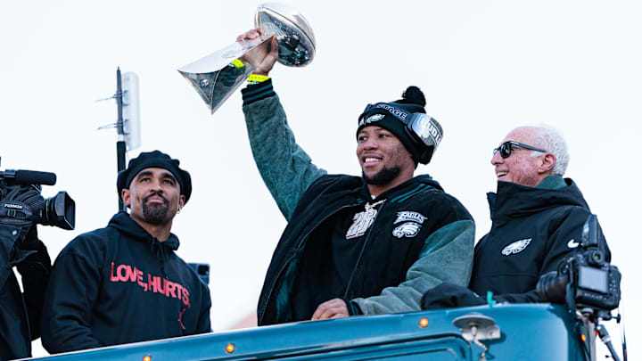 Feb 14, 2025; Philadelphia, PA, USA; Philadelphia Eagles running back Saquon Barkley (26) lifts the Lombardi Trophy during the Super Bowl LIX championship parade and rally. Feb 14, 2025; Philadelphia, PA, USA; Philadelphia Eagles running back Saquon Barkley (26) lifts the Lombardi Trophy during the Super Bowl LIX championship parade and rally.