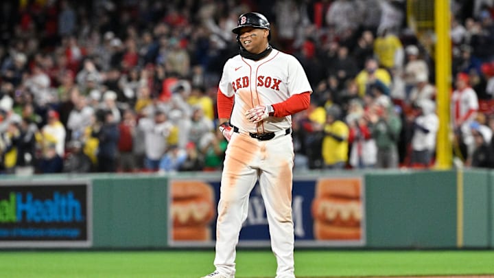 Apr 6, 2025; Boston, Massachusetts, USA; Boston Red Sox designated hitter Rafael Devers (11) reacts to his RBI double against the St. Louis Cardinals during the sixth inning at Fenway Park. Mandatory Credit: Eric Canha-Imagn Images