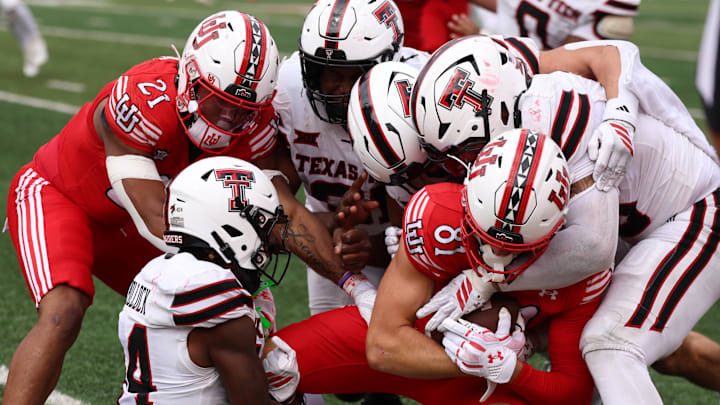 Sep 20, 2025; Salt Lake City, Utah, USA; The Texas Tech Red Raiders defense stops Utah Utes tight end JJ Buchanan (81) from getting a first down during the third quarter at Rice-Eccles Stadium. Mandatory Credit: Rob Gray-Imagn Images