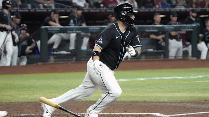 Jun 14, 2024; Phoenix, Arizona, USA; Arizona Diamondbacks catcher Tucker Barnhart (16) hits an RBI single against the Chicago White Sox in the second inning at Chase Field. Jun 14, 2024; Phoenix, Arizona, USA; Arizona Diamondbacks catcher Tucker Barnhart (16) hits an RBI single against the Chicago White Sox in the second inning at Chase Field.