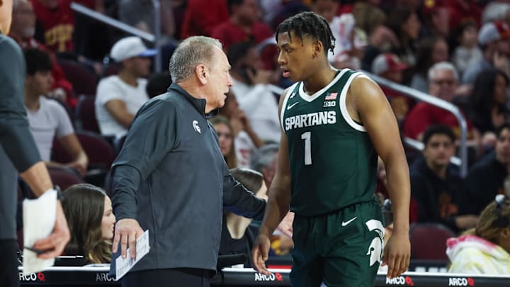 Feb 1, 2025; Los Angeles, California, USA;  Michigan State Head Coach Tom Izzo talks to  guard Jeremy Fears Jr. (1) on the sideline during the first half against the USC Trojans at Galen Center. Mandatory Credit: William Navarro-Imagn Images