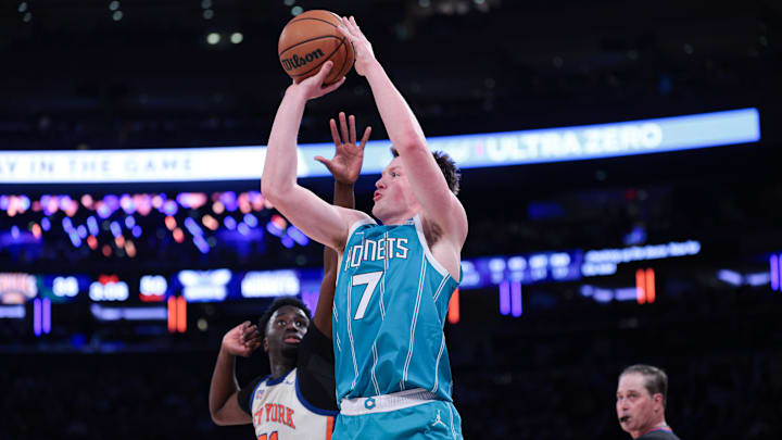 Charlotte Hornets guard Kon Knueppel (7) shoots the ball as New York Knicks forward Mohamed Diawara (51) defends 