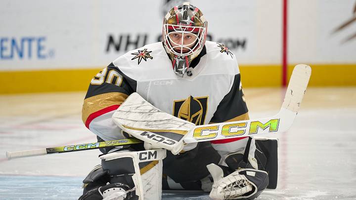 Jan 11, 2026; San Jose, California, USA; Vegas Golden Knights goaltender Carl Lindbom (30) stretches before the second period against the San Jose Sharks at SAP Center at San Jose. Mandatory Credit: Robert Edwards-Imagn Images