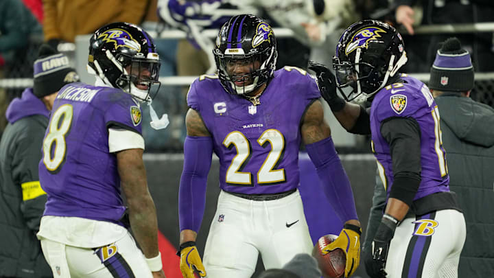 Jan 11, 2025; Baltimore, Maryland, USA; Baltimore Ravens running back Derrick Henry (22) celebrates with wide receiver Nelson Agholor (15) and quarterback Lamar Jackson (8) after scoring a touchdown against the Pittsburgh Steelers in the third quarter in an AFC wild card game at M&T Bank Stadium. Mandatory Credit: Mitch Stringer-Imagn Images