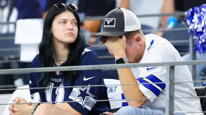 Dallas Cowboys fans react during the second half against the Baltimore Ravens.