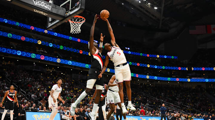 Los Angeles Clippers guard Bones Hyland (5) intercepts a pass intended for Portland Trail Blazers center Duop Reath (26) during the second half at Climate Pledge Arena. 