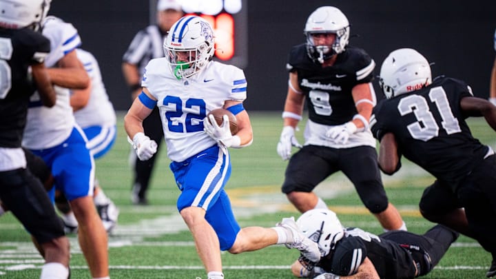 Waukee Northwest's Ryan Woodruff (22) runs the ball in open space for a first down against Des Moines Roosevelt on Thursday, Sept. 12, 2024, at Mediacom Stadium in Des Moines.