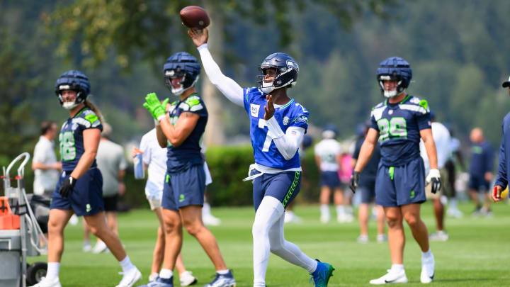 Jul 27, 2024; Renton, WA, USA; Seattle Seahawks quarterback Geno Smith (7) passes the ball during training camp at Virginia Mason Athletic Center. Mandatory Credit: Steven Bisig-USA TODAY Sports Jul 27, 2024; Renton, WA, USA; Seattle Seahawks quarterback Geno Smith (7) passes the ball during training camp at Virginia Mason Athletic Center. Mandatory Credit: Steven Bisig-USA TODAY Sports
