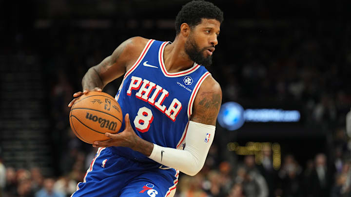 Nov 4, 2024; Phoenix, Arizona, USA; Philadelphia 76ers forward Paul George (8) protects the ball against the Phoenix Suns during the first half at Footprint Center. Mandatory Credit: Joe Camporeale-Imagn Images