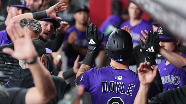 Aug 10, 2025; Phoenix, Arizona, USA; Colorado Rockies outfielder Brenton Doyle (9) celebrates a three run home run against the Arizona Diamondbacks during the seventh inning at Chase Field. Mandatory Credit: Joe Camporeale-Imagn Images