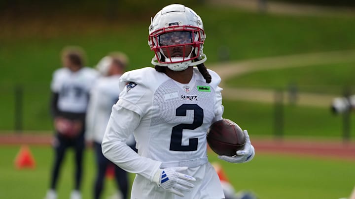 Oct 18, 2024; London, United Kingdom; New England Patriots wide receiver K.J. Osborn (2) carries the ball during practice at the Harrow School. Mandatory Credit: Kirby Lee-Imagn Images