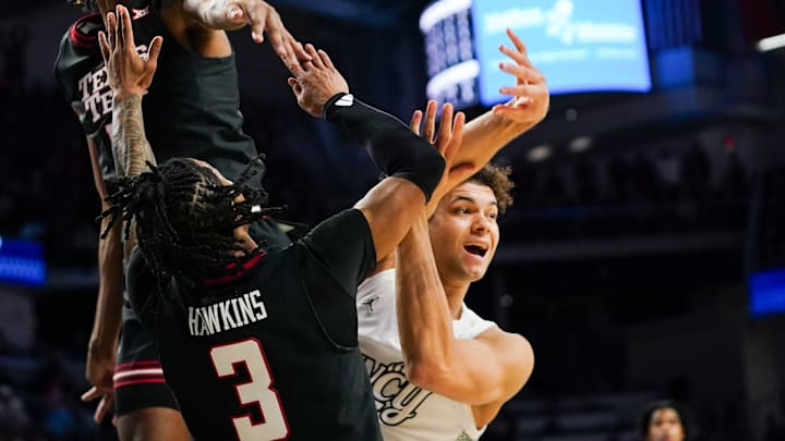 Cincinnati Bearcats guard Dan Skillings Jr. (0) passes the ball in the second half of a NCAA men’s basketball game between the Cincinnati Bearcats and Texas Tech Red Raiders, Tuesday, Jan. 21, 2025, at Fifth Third Arena in Cincinnati. Red Raiders won 81-71.