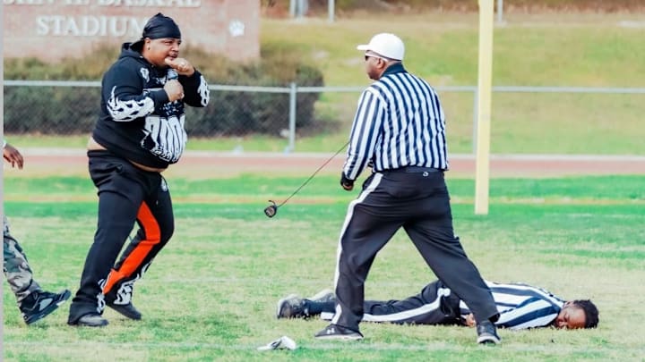 Viral photo of an adult male squaring up with a 7on7 football official at a tournament in North Carolina.