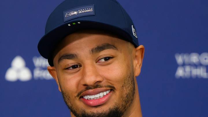 Seattle Seahawks wide receiver Jaxon Smith-Njigba is all smiles at a press conference. 