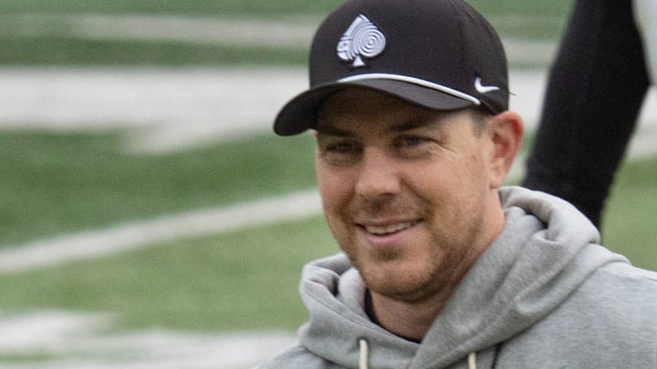 Oregon Offensive Coordinator Will Stein leads a drill with quarterback Dante Moore at Autzen Stadium in Eugene Dec. 14, 2025 before the first-round CFP game against James Madison.