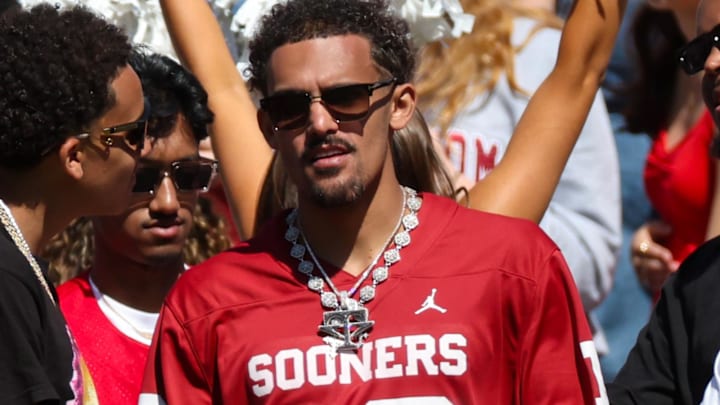 Oct 7, 2023; Dallas, Texas, USA;  Former Oklahoma Sooners basketball and current Atlanta Hawks player Trae Young on the sidelines during the game against the Texas Longhorns at the Cotton Bowl. Mandatory Credit: Kevin Jairaj-Imagn Images