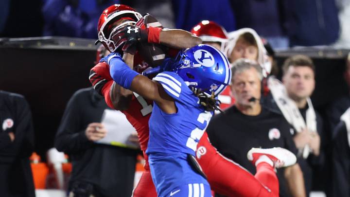 Oct 18, 2025; Provo, Utah, USA; Utah Utes wide receiver Larry Simmons (12) and BYU Cougars defensive back Jonathan Kabeya (2) battle for a thrown ball during the second quarter at LaVell Edwards Stadium. Mandatory Credit: Rob Gray-Imagn Images Oct 18, 2025; Provo, Utah, USA; Utah Utes wide receiver Larry Simmons (12) and BYU Cougars defensive back Jonathan Kabeya (2) battle for a thrown ball during the second quarter at LaVell Edwards Stadium. Mandatory Credit: Rob Gray-Imagn Images