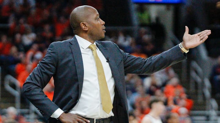 Dennis Gates gestures during the Braggin Rights game